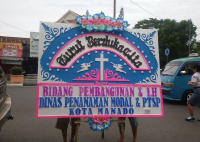 Papan bunga duka cita di manado